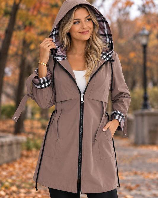 Brown Adeline-Lane hooded coat with plaid-lined hood, worn with the hood up