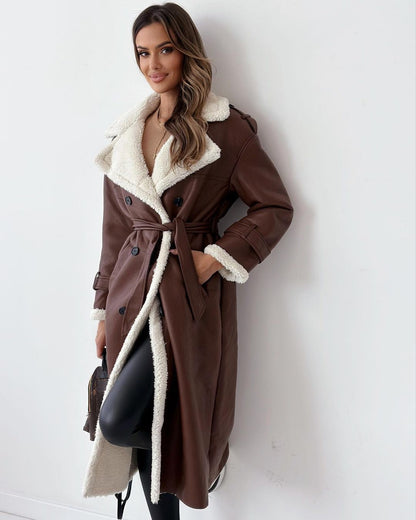 Woman wearing the brown double-breasted teddy coat with cream shearling collar, front view
