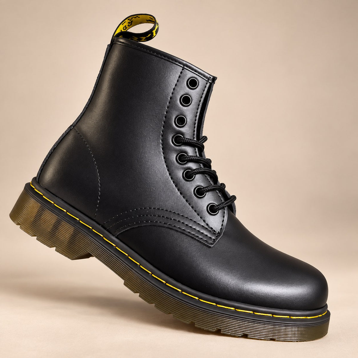 Side view of black unisex lace-up boot with rubber sole
