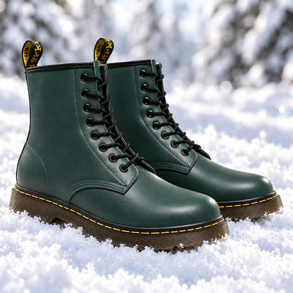 Green vegan leather lace-up boots in the snow