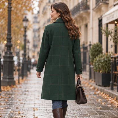 Back view of the dark green tweed plaid coat showing the full length and cuff tabs